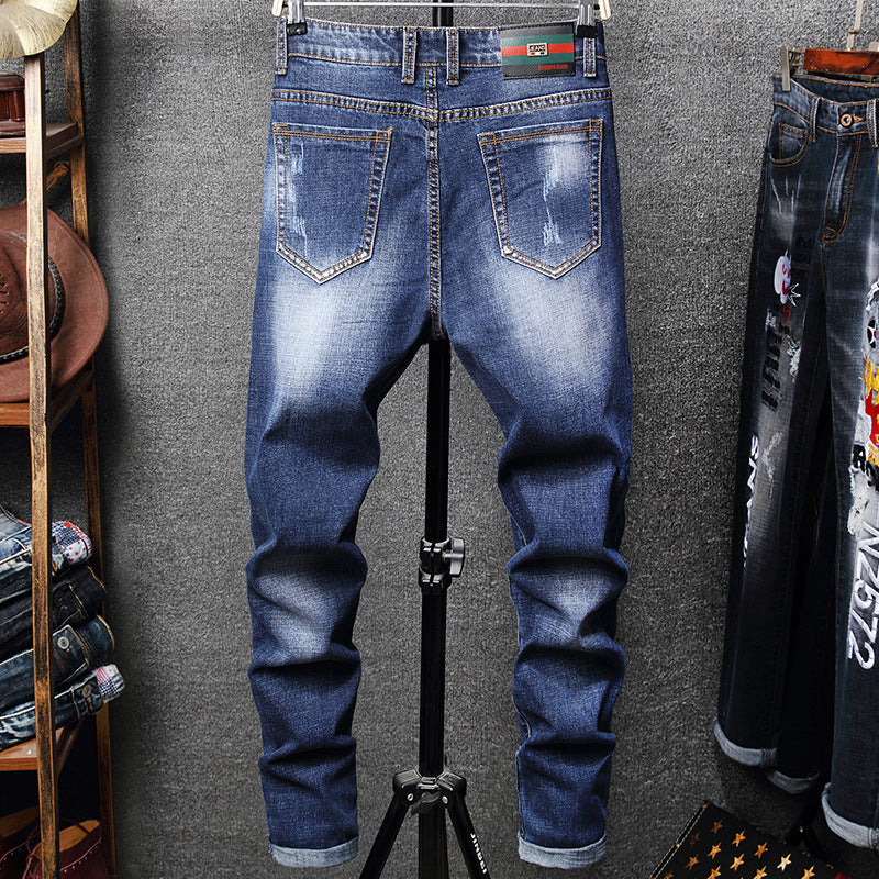 Broken Hole Embroidered Pencil jeansDescription:Closure Type: Zipper FlyApplicable Season: Four SeasonsApplicable Scene: DailyStyle: HIP HOPWaist Type: MIDDecoration: EmbroideryPattern Type: LetterMate